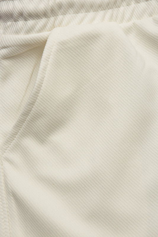 Ecru sportovní kalhoty s kapsami