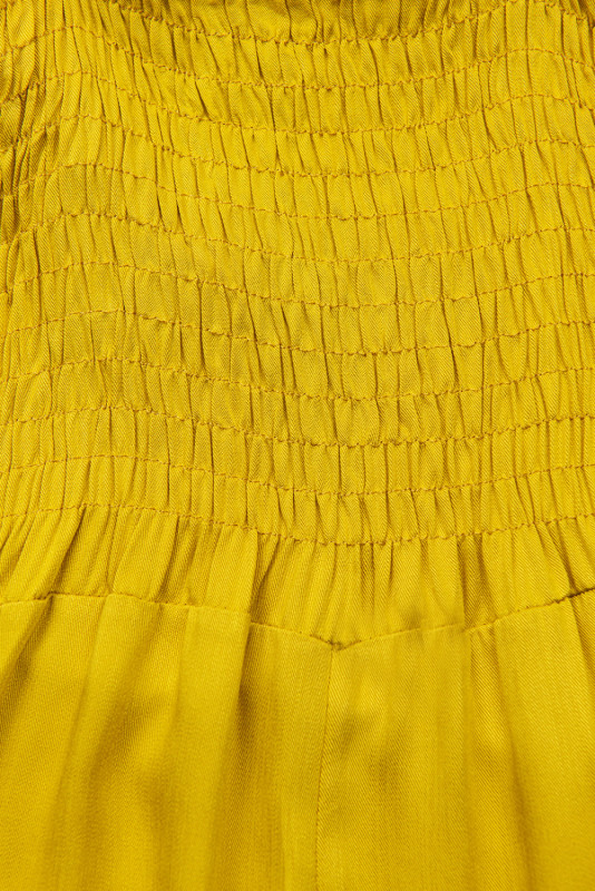 Žlutý kalhotový overal