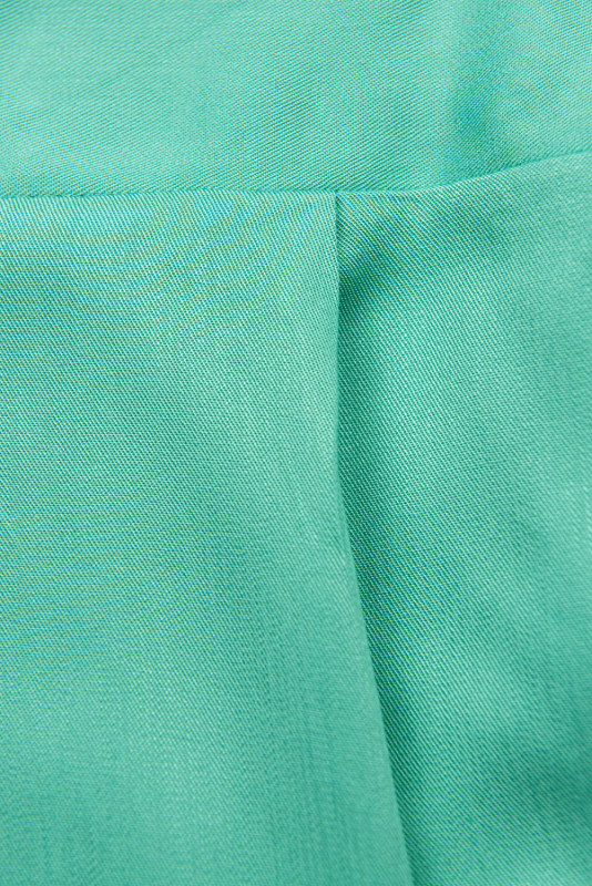 Tyrkysově zelený kalhotový overal