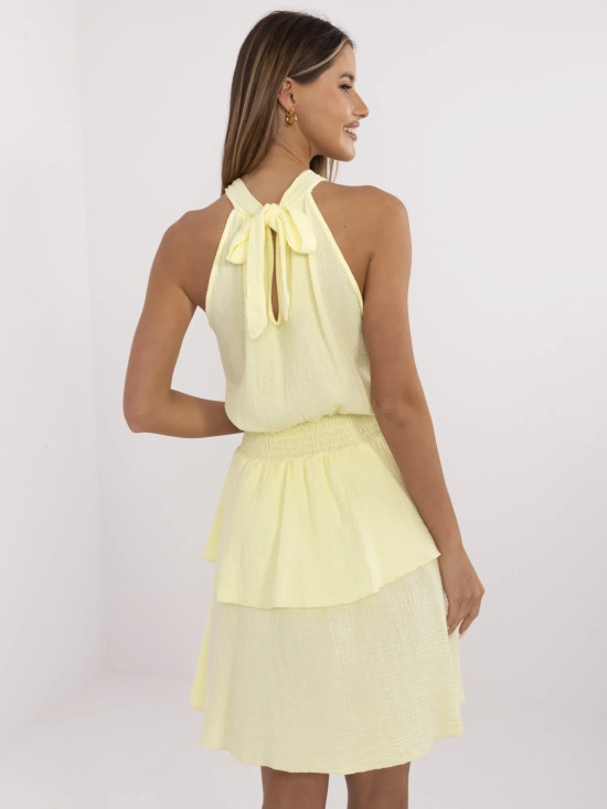 Světle žluté minišaty s volánem a vázáním