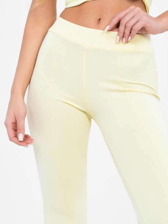 Žluté široké sportovní kalhoty s vysokým pasem