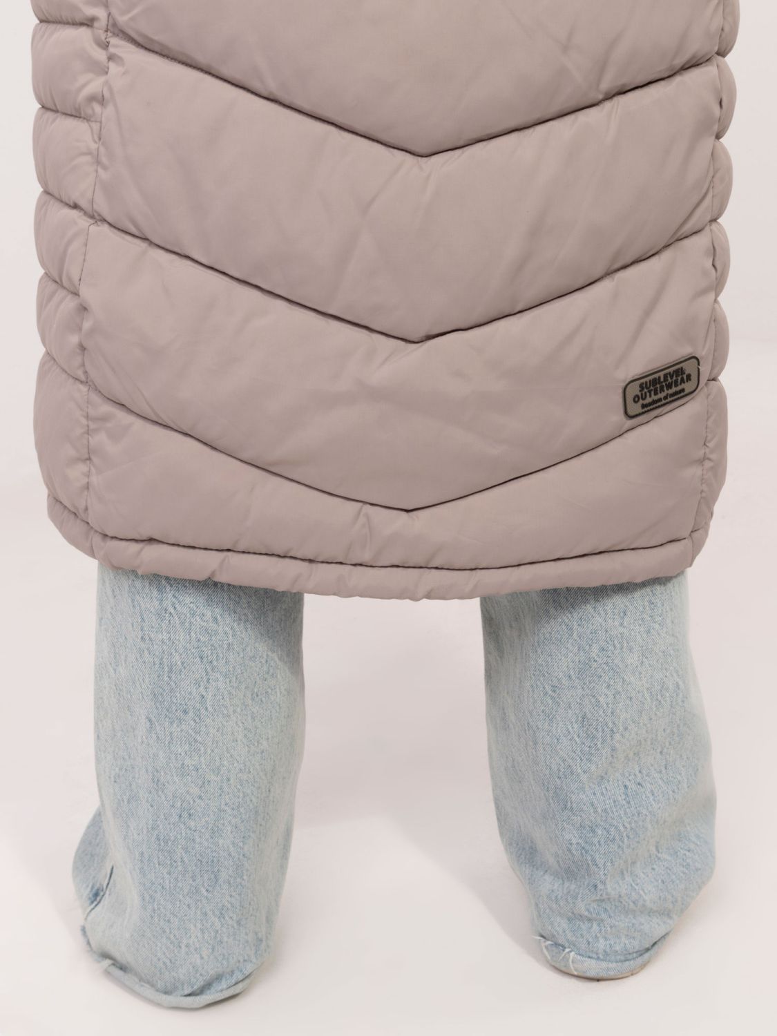 Dlouhý béžový kabát s podšívkou