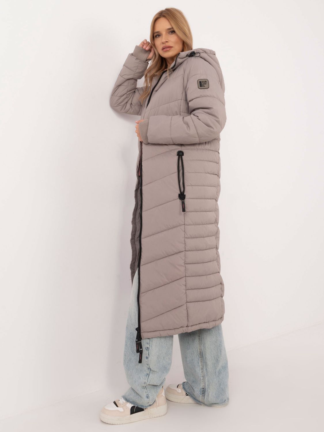 Dlouhý béžový kabát s podšívkou