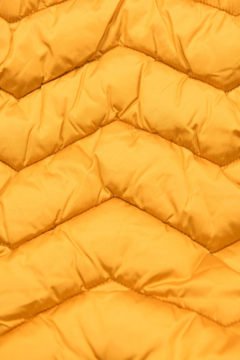 Zimní prošívaná bunda s páskem žlutá