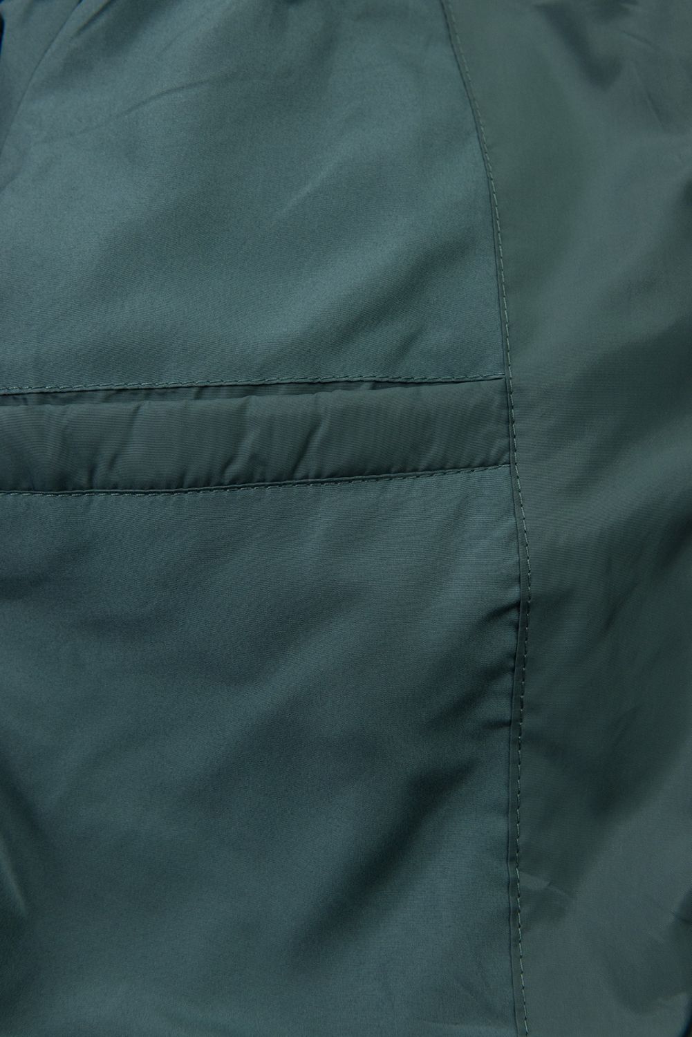 Prodloužená dámská zimní bunda petrolejově zelená