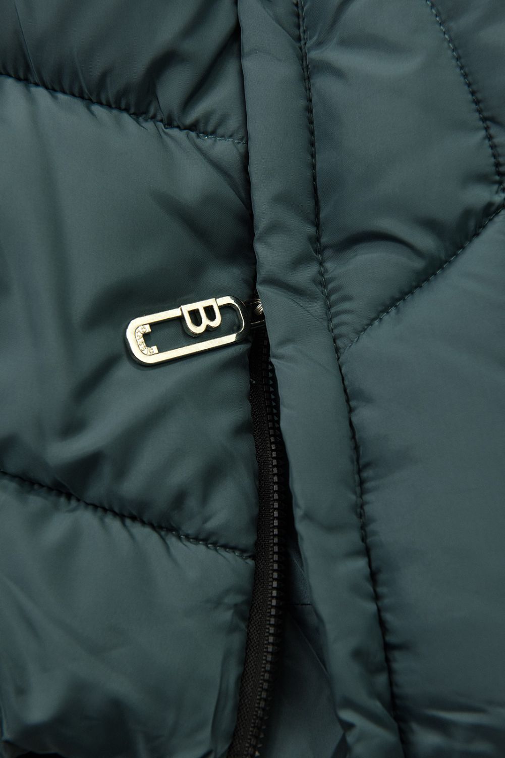 Prodloužená dámská zimní bunda petrolejově zelená