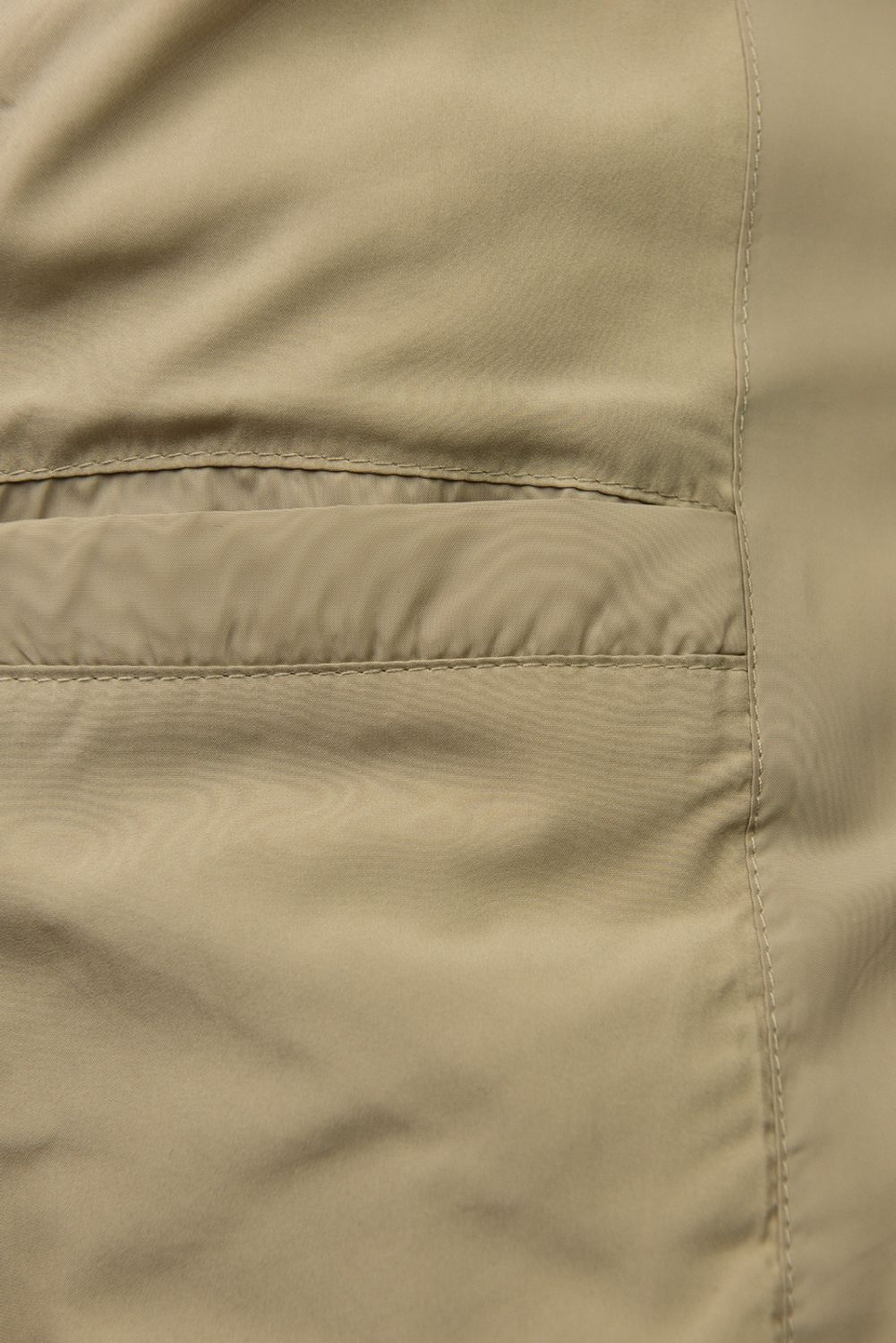 Béžová prošívaná bunda s páskem