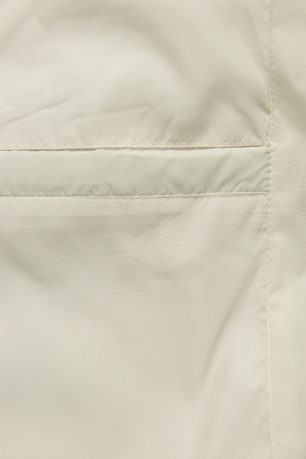 Ecru přechodná bunda s pletenými rukávy