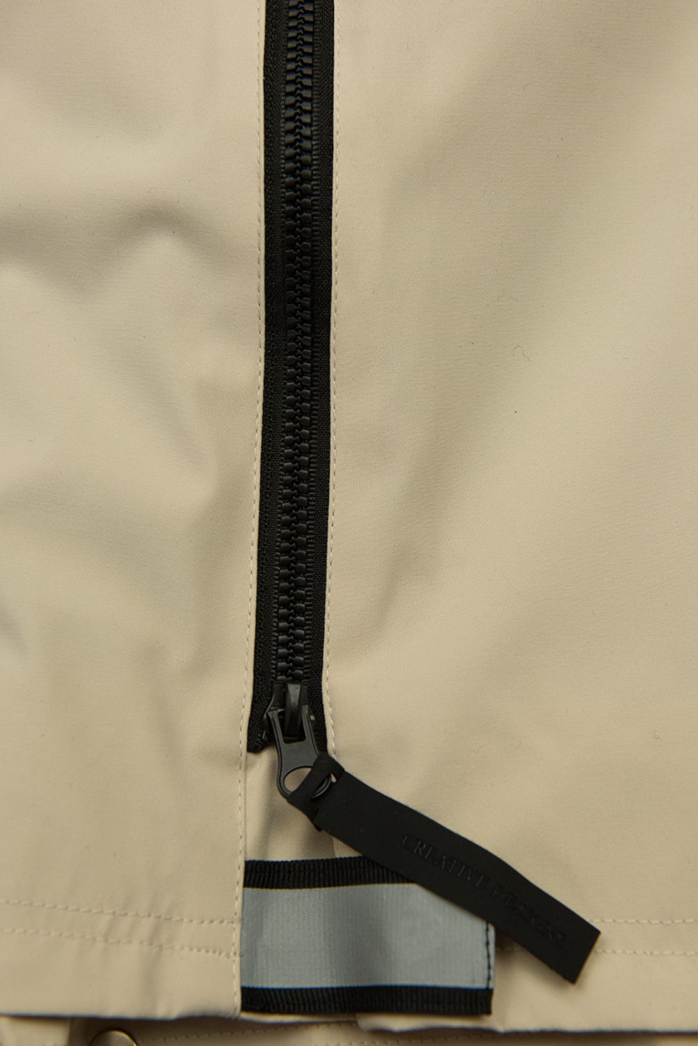 Béžová přechodná parka se stahováním v pase