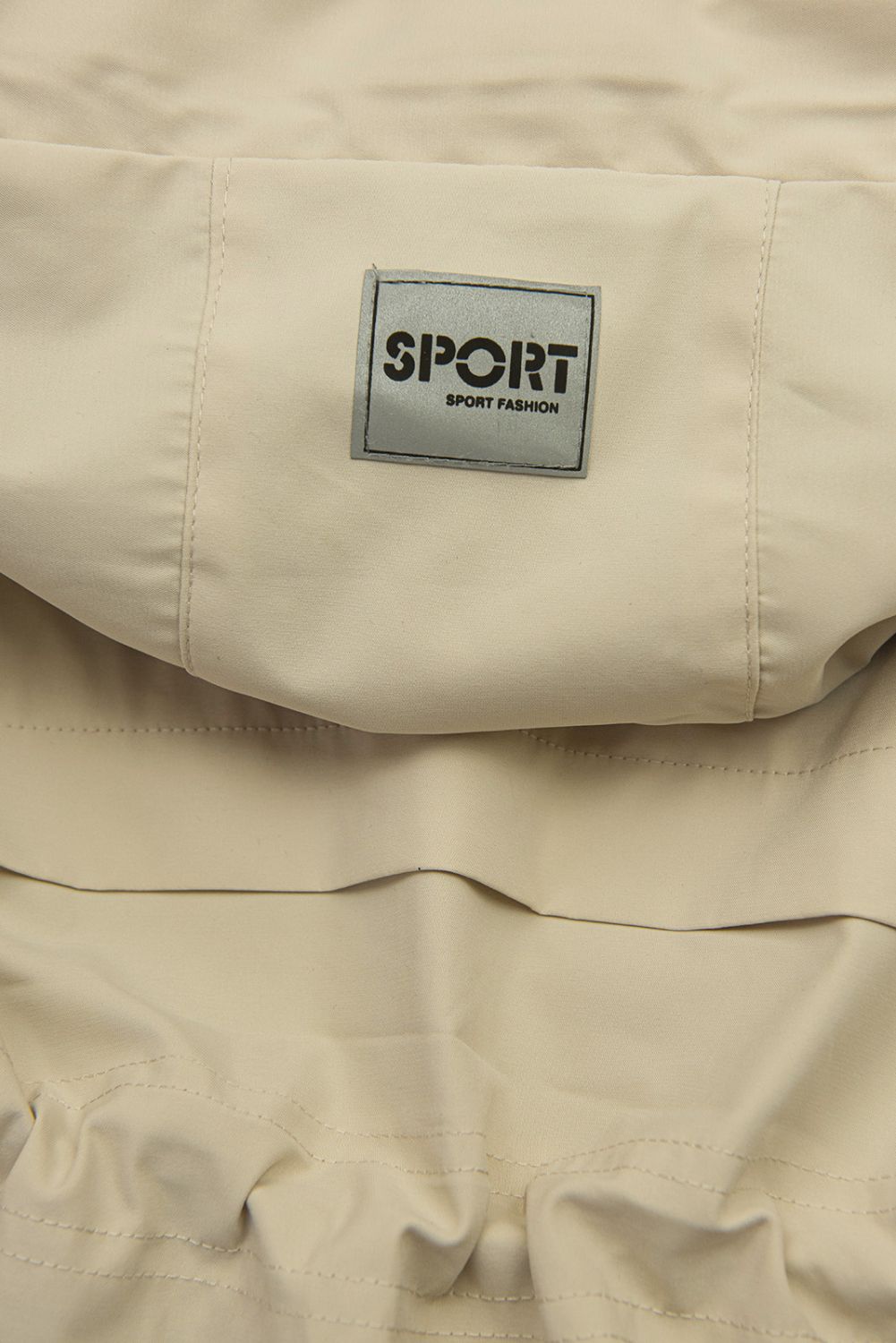 Béžová přechodná parka se stahováním v pase