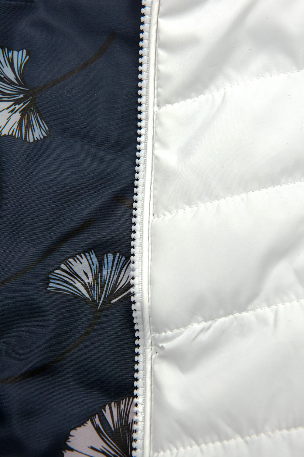 Bílá oboustranná přechodná bunda