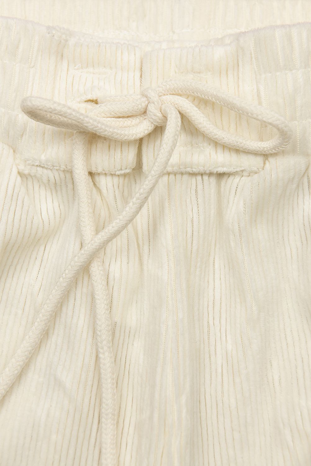 Ecru kalhoty se šněrováním v pase