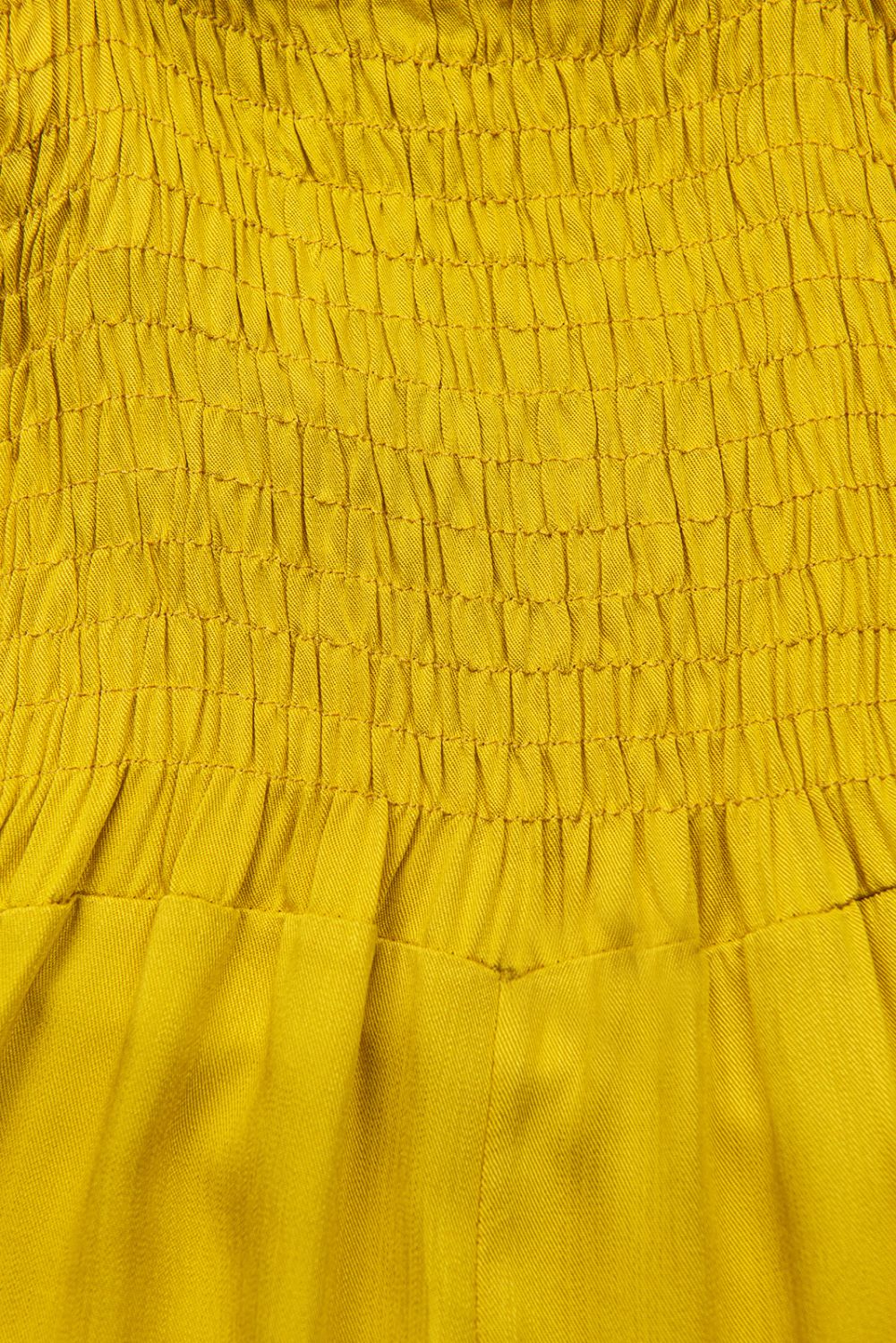 Žlutý kalhotový overal