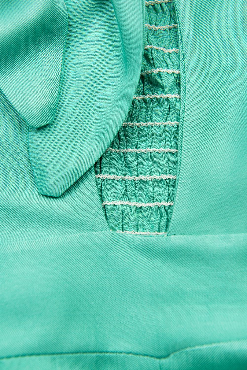 Tyrkysově zelený kalhotový overal