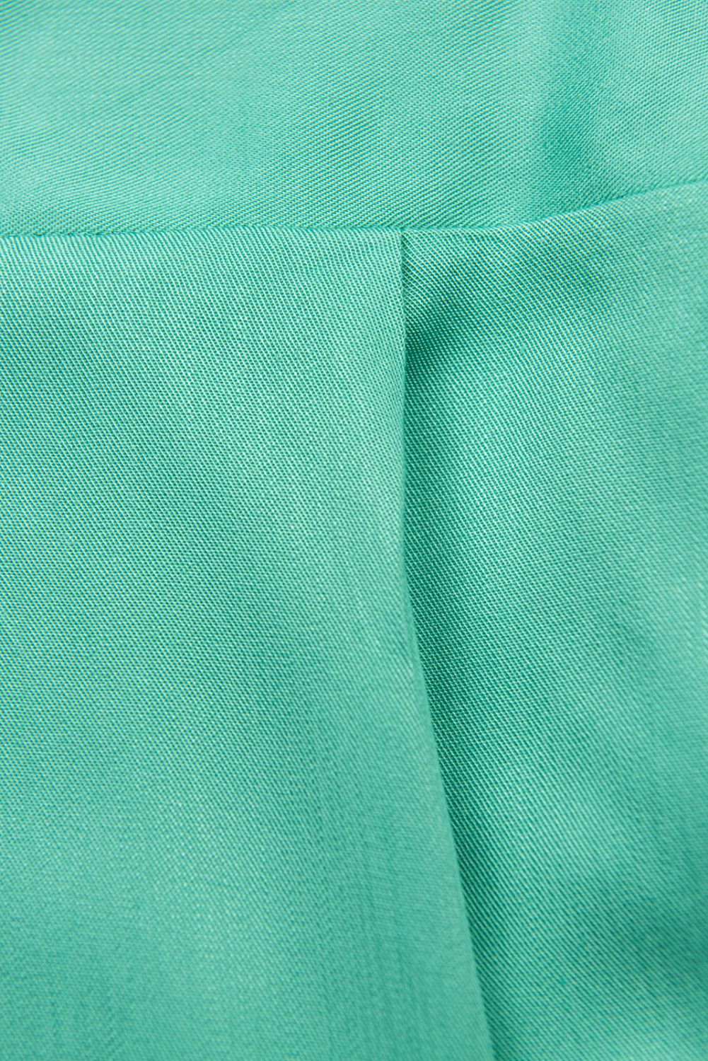 Tyrkysově zelený kalhotový overal