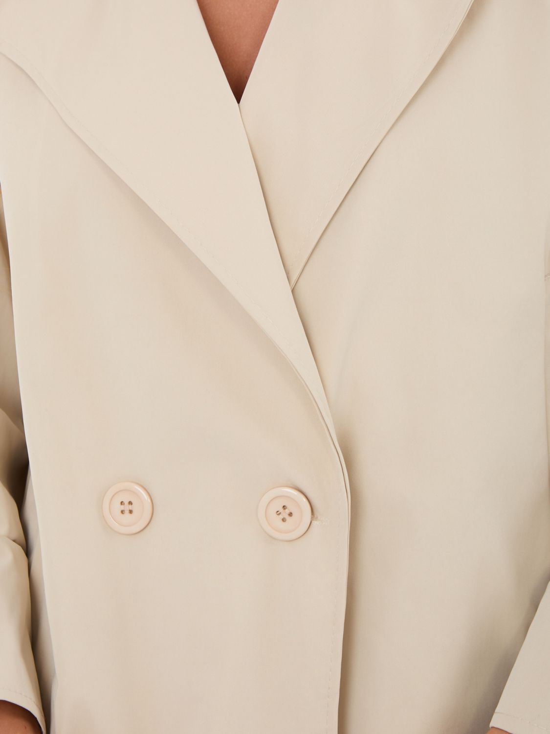 Krátký béžový přechodný kabát s podšívkou