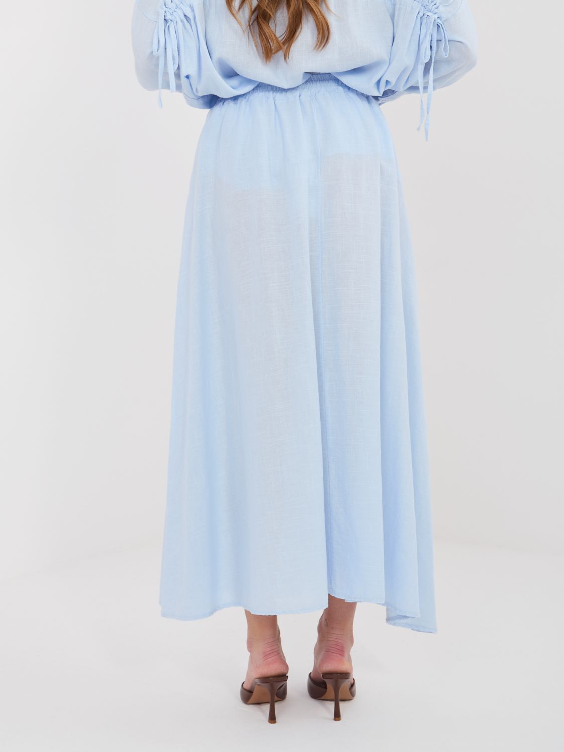 Světle modrá midi sukně s vázáním