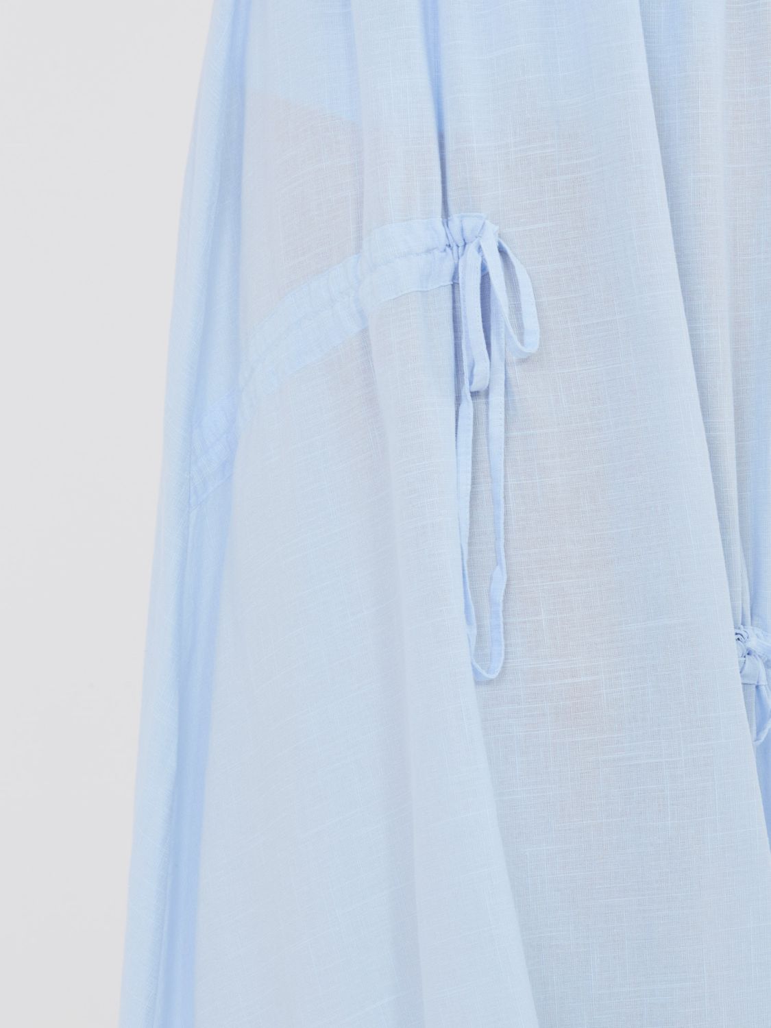 Světle modrá midi sukně s vázáním