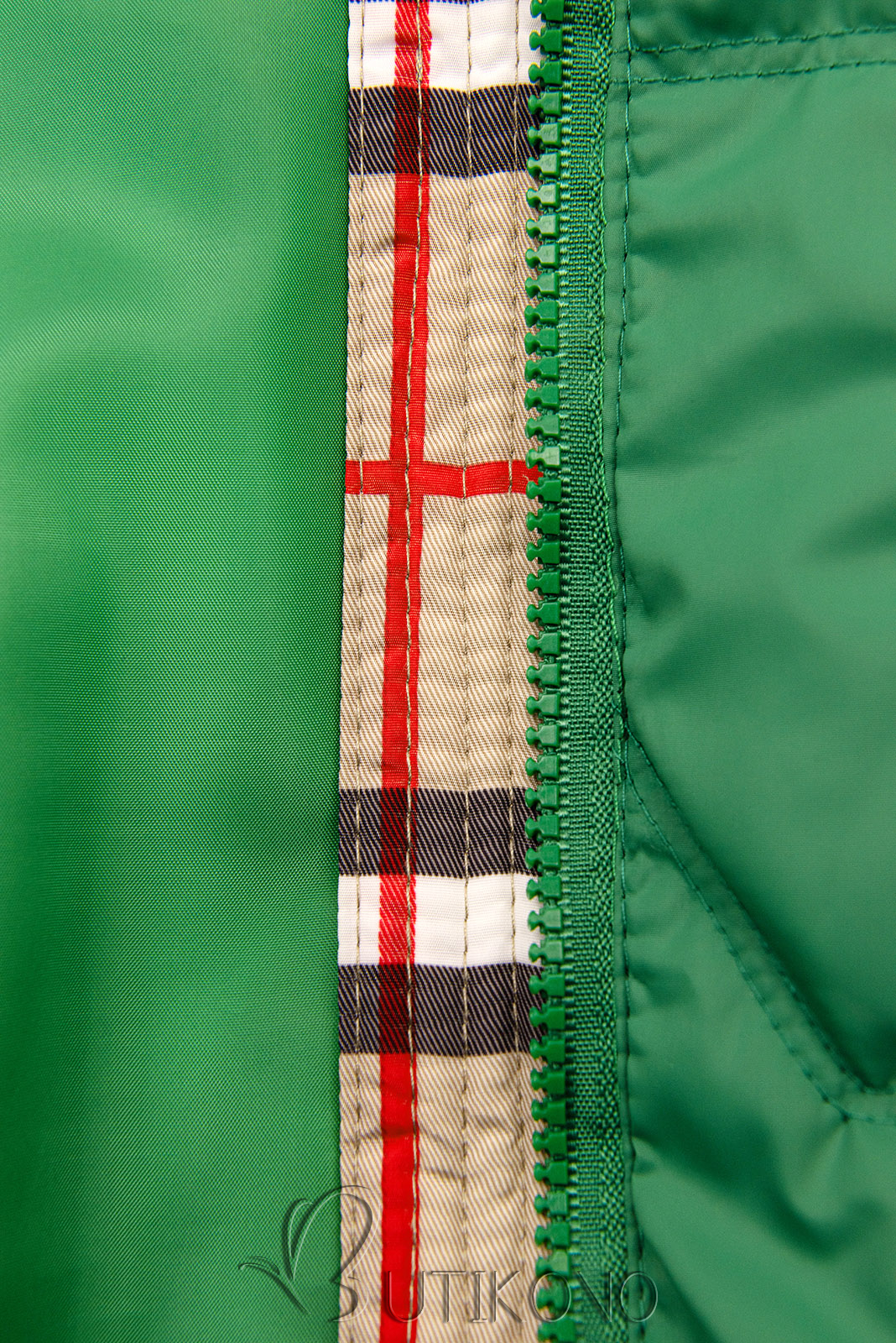 Zelená přechodná bunda s károvaným lemem