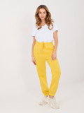 Žluté teplákové kalhoty s vysokým pasem a kapsami